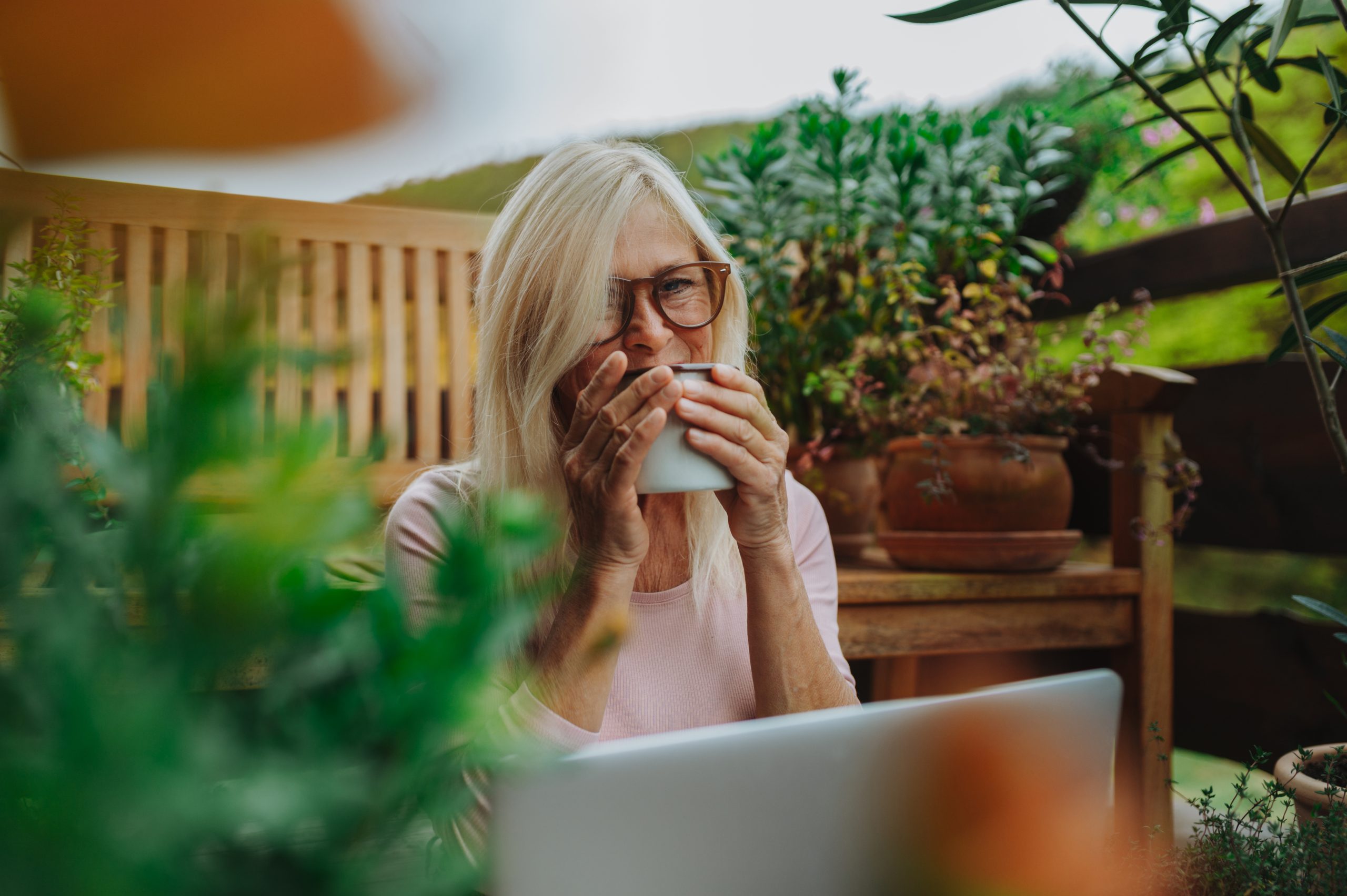 Mature woman relaxing on a Mediterranean terrace
